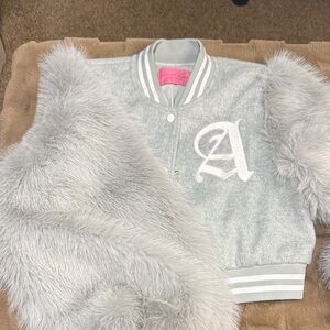 Grey varsity jacket with the letter A and grey fur sleeves